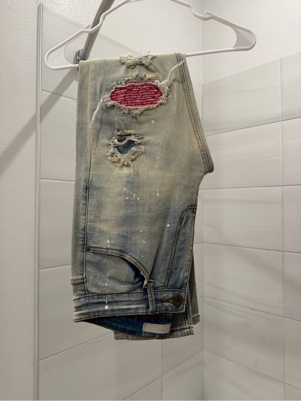 Slim Light Blue Distressed Men’s Jeans with Red Patch Detail